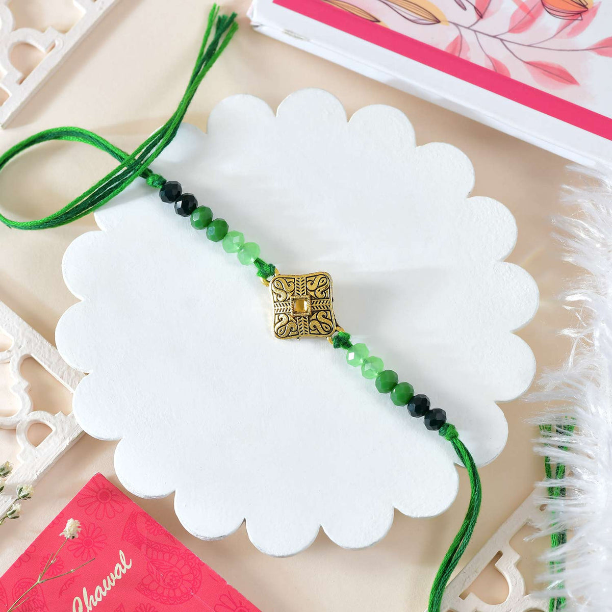 Elegant Beaded Rakhi with Green Thread With Cashew