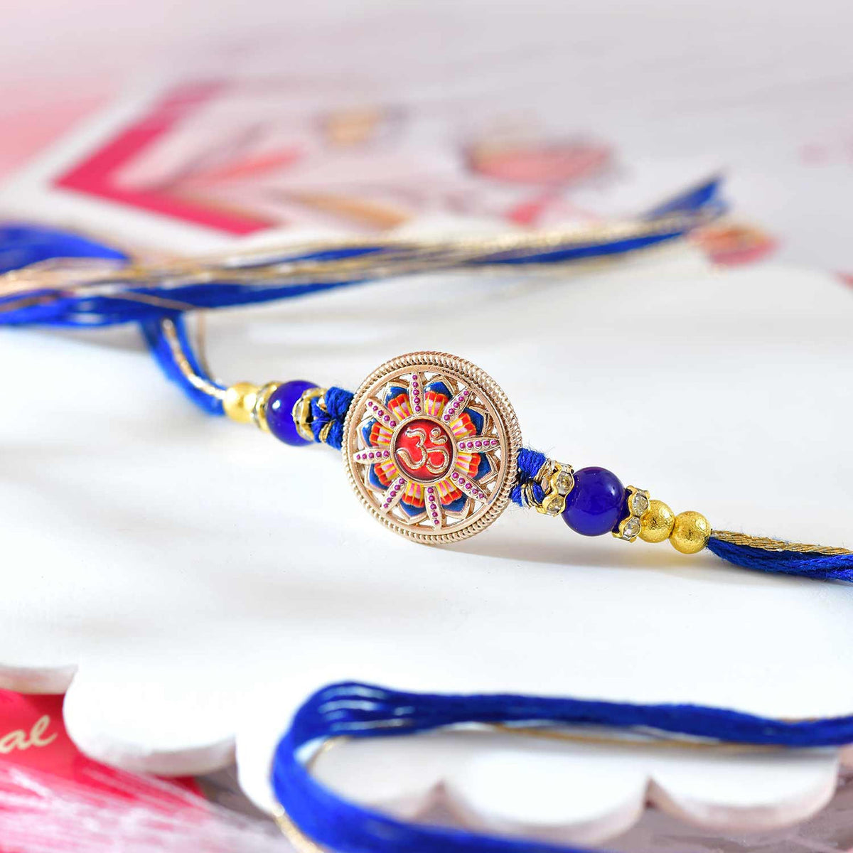 Divine Om Rakhi with Royal Blue Thread